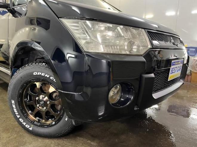 デリカＤ：５　Ｇプレミアム　本州仕入　禁煙車　寒冷地仕様　マッドクロス１６インチＡＷ＋新品ＴＯＹＯオープンカントリーホワイトレター　社外１６ＡＷ＋スタッドレスタイヤ付　新品ＪＡＯＳブラックマッドガード　両側パワースライドドア　パワーバックドア　純正ＨＤＤナビ（地デジ　ＤＶＤ再生　Ｂｌｕｅｔｏｏｔｈ）＋バックカメラ　純正リアフリップダウンモニター　クルーズコントロール　両席シートヒーター　パワーシート　スマートキー　パドルシフト　横滑り防止装置　盗難防止装置　リアヒーター　ＨＩＤ　ＥＴＣ 4WD 2400 5Dr
