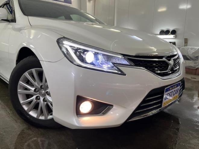 マークXプレミアム　Ｆｏｕｒ　本州仕入　寒冷地仕様　禁煙車　ＷＡＫＯＳバリアスコーティング済　純正１６インチＡＷ　純正１６ＡＷ＋スタッドレスタイヤ付　純正ナビ（フルセグ地デジ　ＤＶＤ再生　Ｂｌｕｅｔｏｏｔｈ対応）＋バックカメラ　純正ハーフレザーシート　エンジンスターター　クルーズコントロール　ＰＵＳＨスタート　スマートキー　フロントガラス熱線　ミラーヒーター　両席パワーシート　タイミングチェーン車　ＨＩＤヘッドライト　横滑り防止装置　ＥＴＣ 4WD 2500 4Dr