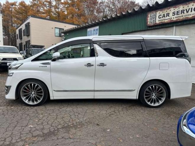 ヴェルファイアハイブリッド 2.5 V E-Four 4WD　社外アルミ　オートミラー　ETC　ドライブレコーダー　ローダウン　ワンオーナー　両側電動スライドドア　パワステ　パワーウィンドウ　ベージュ革シート　純正ナビ　バックカメラ　ABS　キーレスエントリー 2500