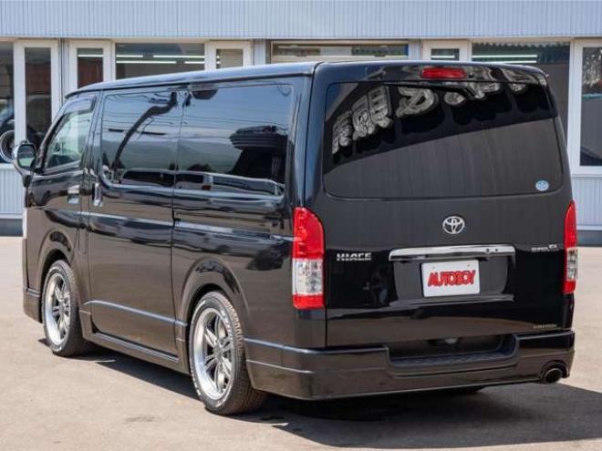 ハイエースバン2.8ダークプライム マルチロールトランスポータータイプIIロング ディーゼルターボ4WD　モデリスタフルエアロ・415COBRAバッドラッカー18インチAW・純正SDナビTV・Bカメラ・両側パワスラ・LEDライト・スマキー・AC100V・ベッドキット・エンスタ 2800