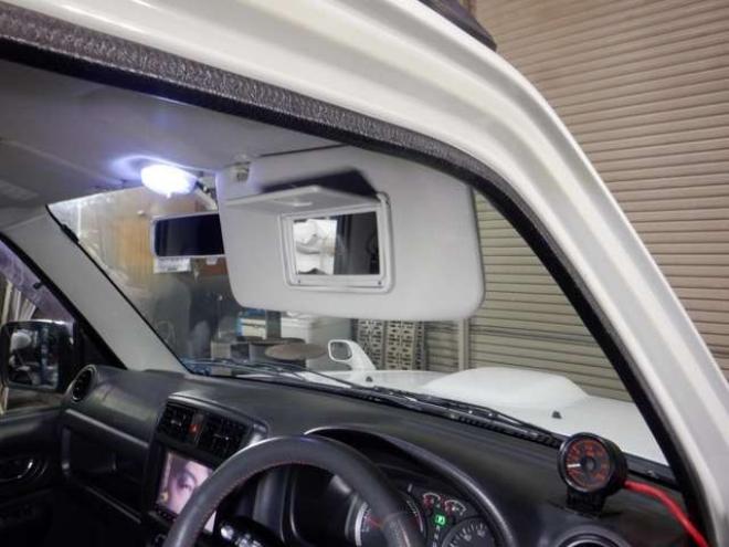 ジムニーワイルドウインド 4WD　本州仕入・ナビ・TV・Bカメラ・専用レザーシート・ETC・キーレス・シートヒーター・フォグランプ・ターボ・純正AW・電動格納ミラー・ミラーヒーター・ルーフレール 660