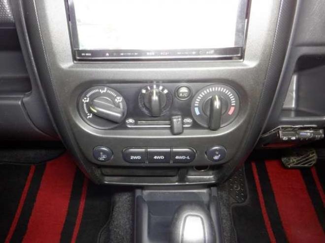 ジムニーワイルドウインド 4WD　本州仕入・ナビ・TV・Bカメラ・専用レザーシート・ETC・キーレス・シートヒーター・フォグランプ・ターボ・純正AW・電動格納ミラー・ミラーヒーター・ルーフレール 660