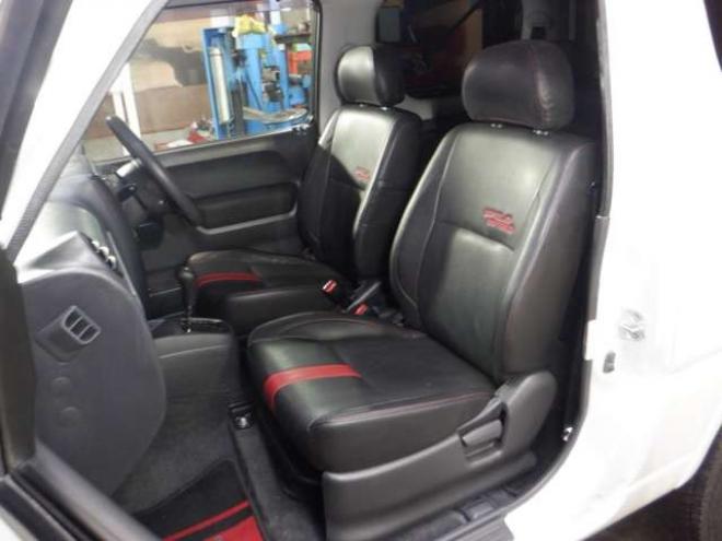 ジムニーワイルドウインド 4WD　本州仕入・ナビ・TV・Bカメラ・専用レザーシート・ETC・キーレス・シートヒーター・フォグランプ・ターボ・純正AW・電動格納ミラー・ミラーヒーター・ルーフレール 660