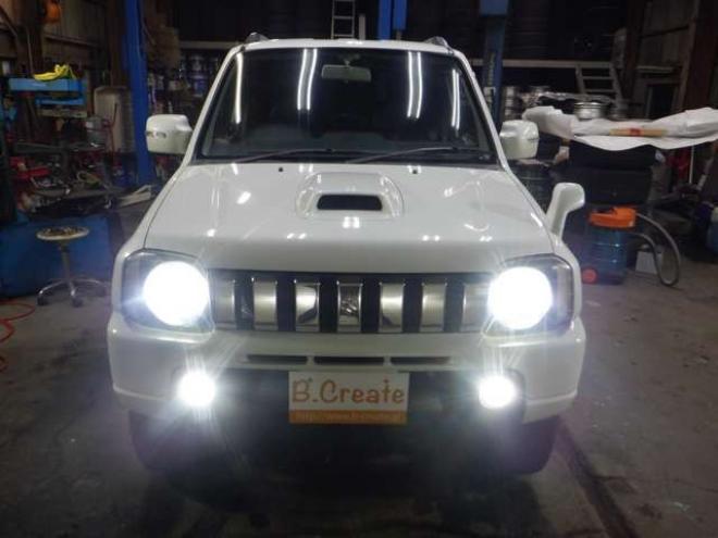 ジムニーワイルドウインド 4WD　本州仕入・ナビ・TV・Bカメラ・専用レザーシート・ETC・キーレス・シートヒーター・フォグランプ・ターボ・純正AW・電動格納ミラー・ミラーヒーター・ルーフレール 660