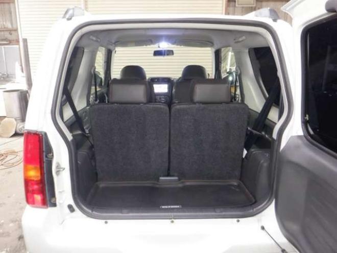 ジムニーワイルドウインド 4WD　本州仕入・ナビ・TV・Bカメラ・専用レザーシート・ETC・キーレス・シートヒーター・フォグランプ・ターボ・純正AW・電動格納ミラー・ミラーヒーター・ルーフレール 660