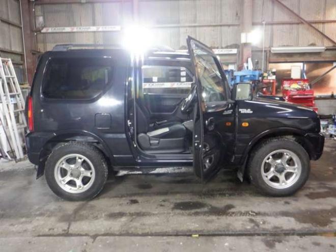 ジムニーワイルドウインド 4WD　本州仕入・ナビ・フルセグTV・キーレス・フォグランプ・シートヒーター・ミラーヒーター・ルーフレール・ターボ・社外AW・ライトレベライザー・電動格納ミラー・DVD再生・JAOSマッドガード 660