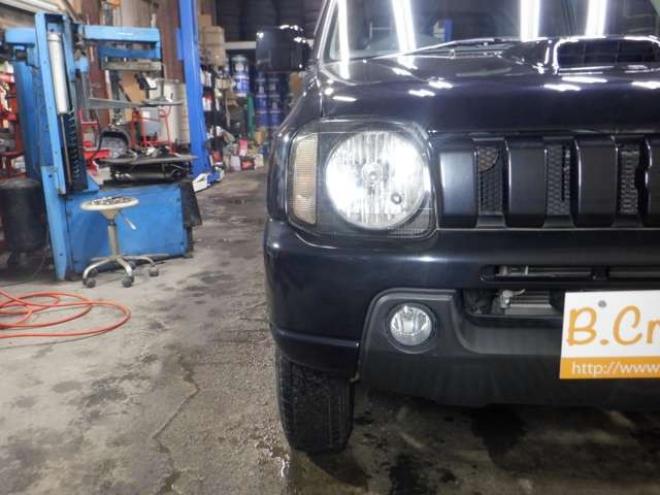 ジムニーワイルドウインド 4WD　本州仕入・ナビ・フルセグTV・キーレス・フォグランプ・シートヒーター・ミラーヒーター・ルーフレール・ターボ・社外AW・ライトレベライザー・電動格納ミラー・DVD再生・JAOSマッドガード 660