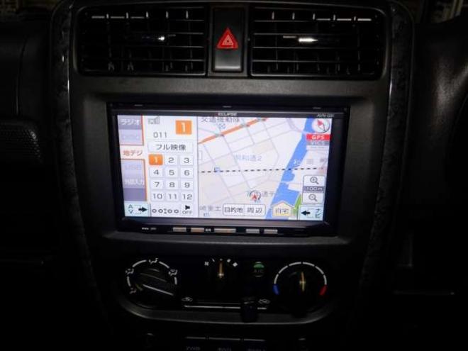 ジムニーワイルドウインド 4WD　本州仕入・ナビ・フルセグTV・キーレス・フォグランプ・シートヒーター・ミラーヒーター・ルーフレール・ターボ・社外AW・ライトレベライザー・電動格納ミラー・DVD再生・JAOSマッドガード 660