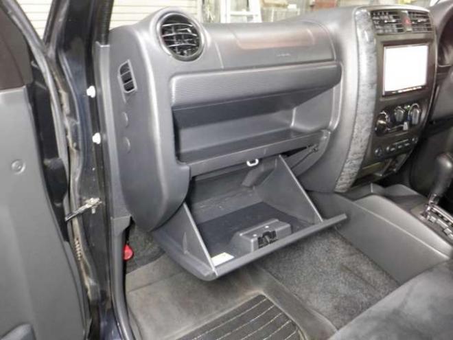 ジムニーワイルドウインド 4WD　本州仕入・ナビ・フルセグTV・キーレス・フォグランプ・シートヒーター・ミラーヒーター・ルーフレール・ターボ・社外AW・ライトレベライザー・電動格納ミラー・DVD再生・JAOSマッドガード 660