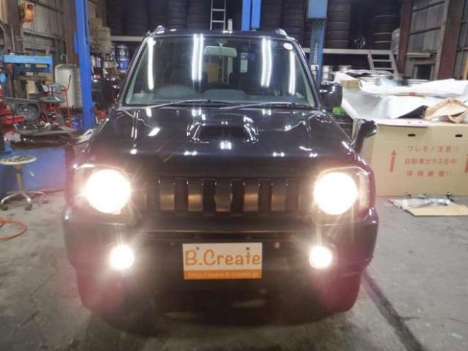 ジムニーワイルドウインド 4WD　本州仕入・ナビ・フルセグTV・キーレス・フォグランプ・シートヒーター・ミラーヒーター・ルーフレール・ターボ・社外AW・ライトレベライザー・電動格納ミラー・DVD再生・JAOSマッドガード 660