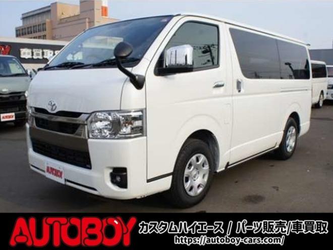 ハイエースバン2.8 スーパーGL ダークプライム S ロングボディ ディーゼルターボ 4WD　ダークプライムS　登録済未使用車　4WD　両側パワースライドドア　デジタルインナーミラー　全方位カメラ　バックカメラ　寒冷地仕様　プッシュスタート　スマートキー　415COBRAフラットベッドキット 登録済未使用車 2800
