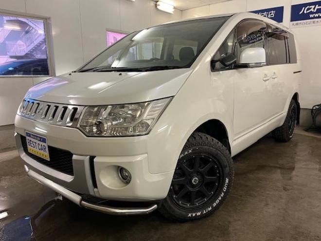 デリカＤ：５　Ｇパワーパッケージ　本州仕入　禁煙車　寒冷地仕様　エクストリーム１６ＡＷ＋ＧＲＩＰＭＡＸホワイトレター　新品ＪＡＯＳブラックマッドガード　純正１８ＡＷ＋スタッドレスタイヤ付　１２インチリアフリップダウンモニター　ＥＴＣ 4WD 2400 5Dr