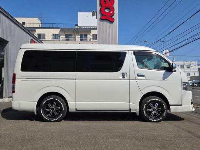 ハイエースバン2.7 スーパーGL ダークプライム ワイド ミドルルーフ ロングボディ 4WD　寒冷地仕様　パワスラ　リアヒーター&クーラー　プッシュスタート　スマートキー　ウッドコンビステアリング&シフトノブ　ハーフレザーシート　ドラレコ　バックカメラ　ETC　メモリナビ　フルセグTV　Bluetooth 2700