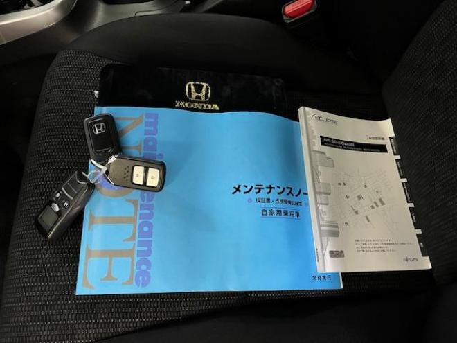 フィット１３Ｇ　Ｌパッケージ　本州仕入　ワンオーナー　寒冷地仕様　禁煙車　社外１５インチＡＷ　スタッドレスタイヤ付　純正ナビ　地デジ　バックカメラ　純正エンジンスターター　フロントガラス熱線　ミラーヒーター　アイドリングストップ 4WD 1300 5Dr
