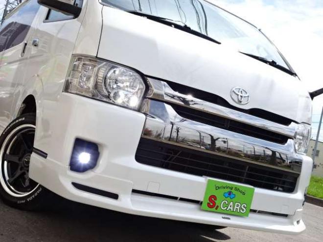 ハイエースバン2.7 スーパーGL ダークプライム ワイド ミドルルーフ ロングボディ 4WD　本州車　保証1年/走行距離無制限 4WD　後期仕様　モデリスタエアロ　両側パワースライドドア　舞杏KBレーシング2アルミホイール　ALPINE製ナビ　地デジ　バックカメラ　現行型ドアミラー　スマートキー ベットキット 2700