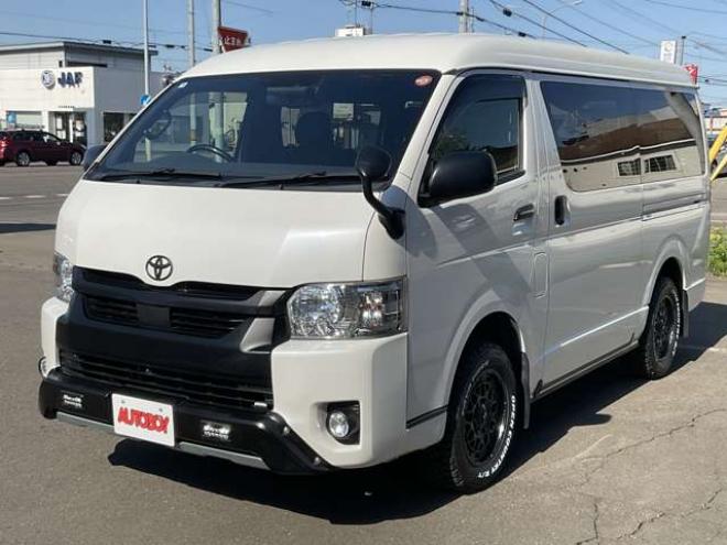 ハイエースバン2.7 スーパーGL ダークプライムII ワイド ミドルルーフ ロングボディ 4WD　TOYOオープンカントリーR/T215/65R16　ナイトロパワーM29スティンガー16インチAW　ワンオーナー　社外ナビTV　両側パワースライドドア　ETC　Pivot製クルコン　Tom's製テールライト　JAOS リヤスキッドバー 2700