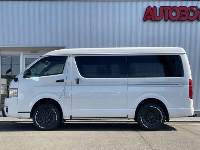 ハイエースバン2.7 スーパーGL ダークプライムII ワイド ミドルルーフ ロングボディ 4WD　TOYOオープンカントリーR/Tタイヤ　ナイトロパワーM29スティンガー16インチAW　ワンオーナー　両側パワースライドドア　ETC　Pivot製オートクルーズ付きスロコン　Tom's製テールライト　JAOS リヤスキッドバー 2700