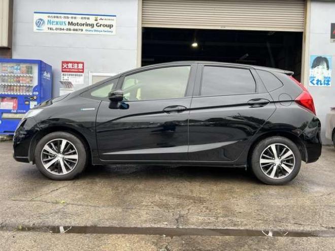 フィットハイブリッド　モデューロスタイル　法定12ヵ月点検整備付・本州仕入車両・Bluetooth対応純正ナビ・カラーバックモニター・ドライブレコーダー・モデューロスタイル・モデューロマフラー 2WD 1500
