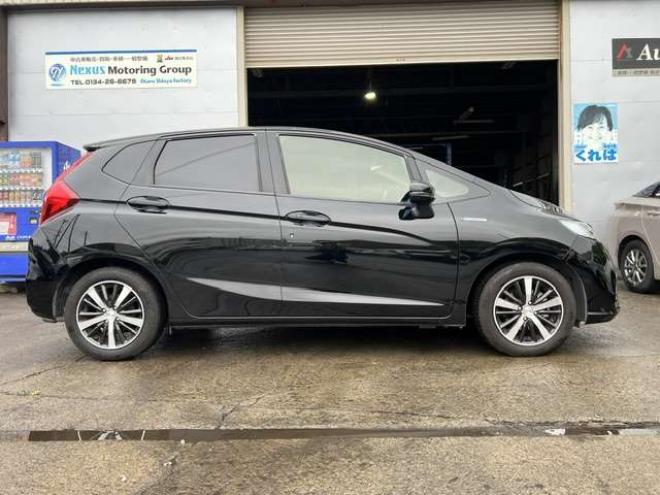 フィットハイブリッド　モデューロスタイル　法定12ヵ月点検整備付・本州仕入車両・Bluetooth対応純正ナビ・カラーバックモニター・ドライブレコーダー・モデューロスタイル・モデューロマフラー 2WD 1500